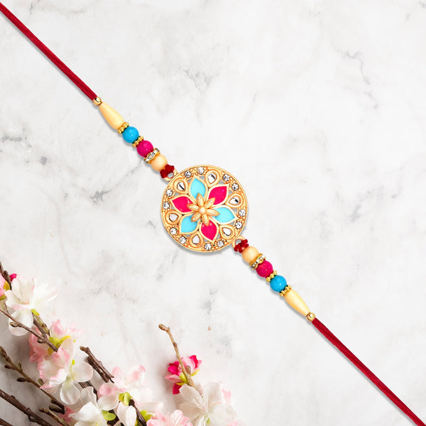 Round Floral Rakhi With Pink-blue Enamel And Beaded Thread